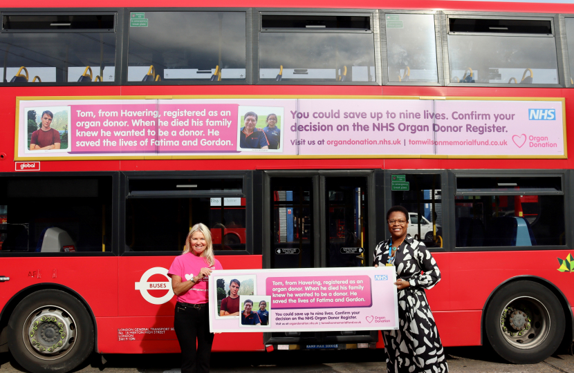 Lisa Wilson of the Tom Wilson Memorial Fund and Janine La Rosa of BHRUT with bus campaign